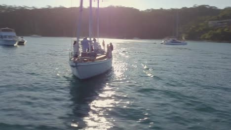 luxury yacht sailing near coastal houses