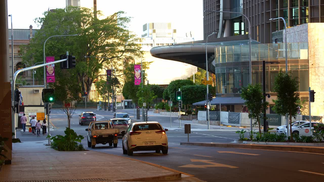 The Star Grand Hotel, luxurious and exclusive 5-star accommodation at Queen's wharf Brisbane city, with cars driving through William street.