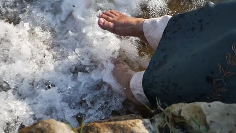 woman's feet in a stream