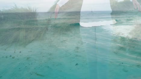 animation of landscape with ocean over caucasian woman at beach