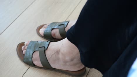 green sandals on a woman's feet