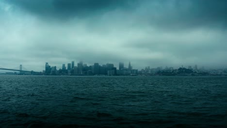 incredibly dark, ominous, and dramatic aerial shot of the new york city skyline in low clouds and heavy fog