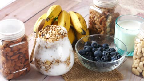 healthy breakfast with granola, fruit, and nuts