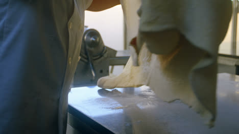 male chef holding a dough in kitchen 4k