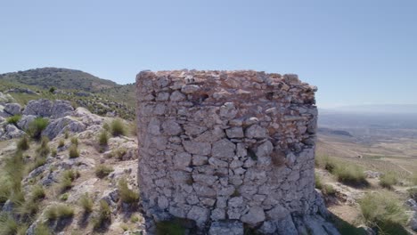 Ruins of a medieval watchtower on a mountain cliff. Medieval watchtower. Aerial tracking shot. Pedro Martinez. Spain