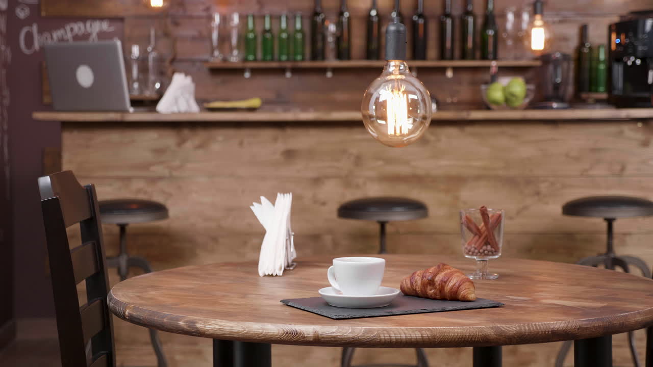 Coffee and Croissant at a Cozy Bar