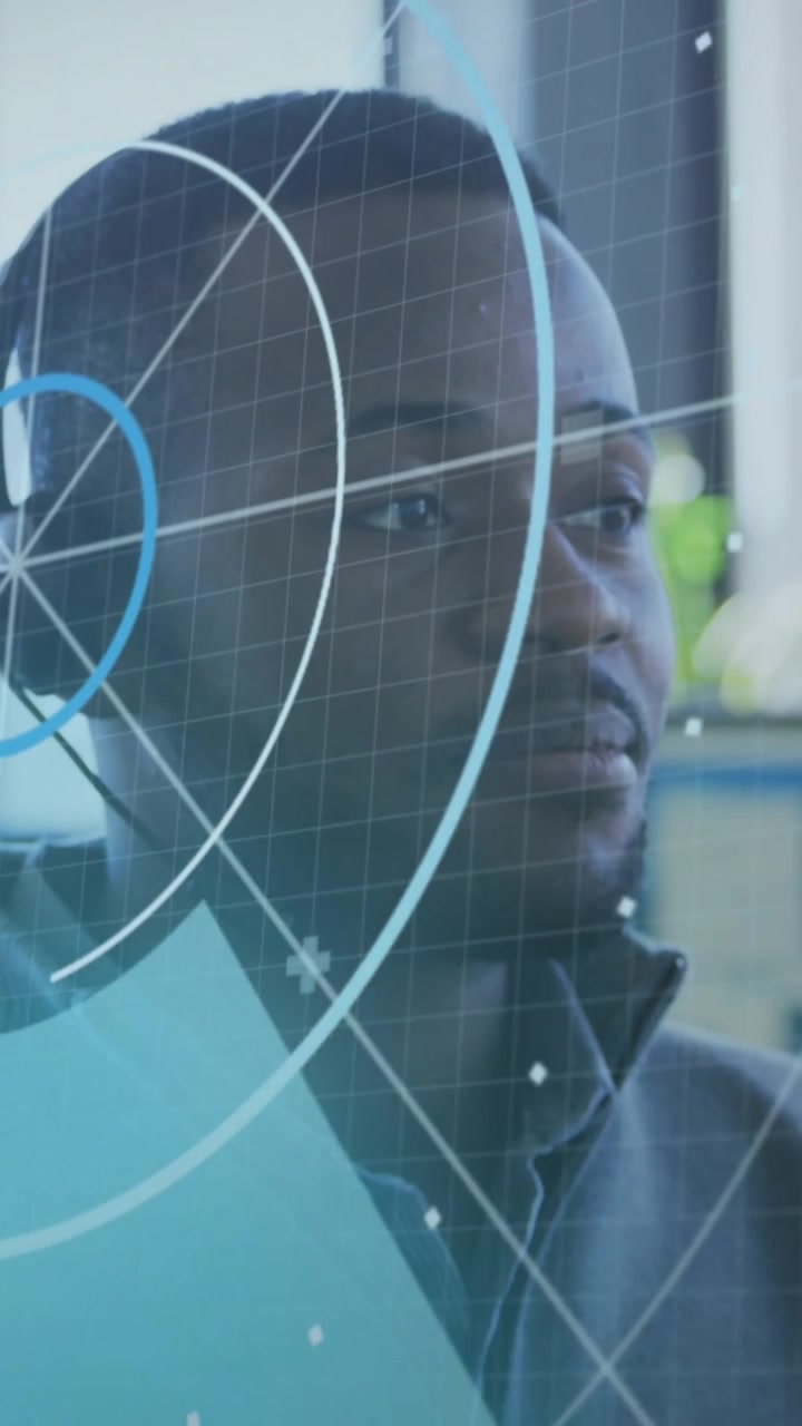 Animation of scope and data processing over african american businessman in office