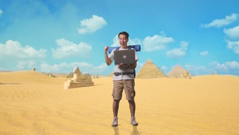 Excited Traveler with Laptop in the Desert