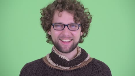 young handsome bearded man with curly hair