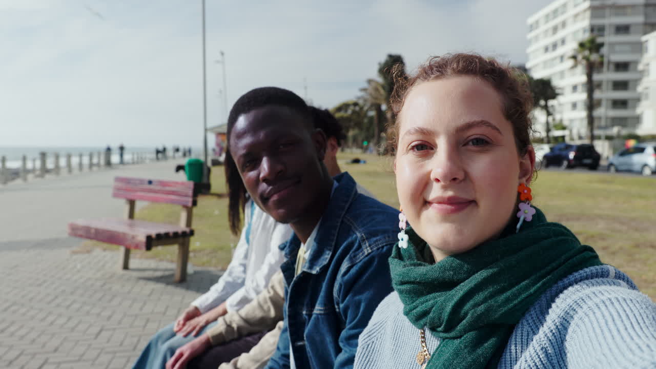 Group of friends taking selfies outdoors in an urban environment