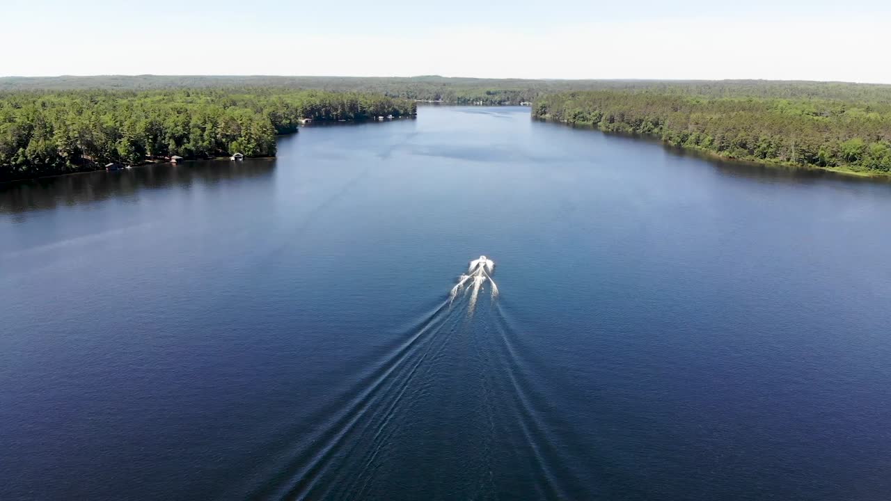 Aerial View of a Boat on a Calm Lake
