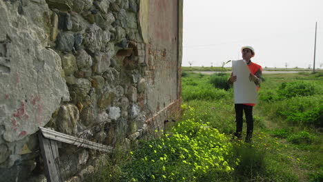 architect looking at the project and the building to rebuild