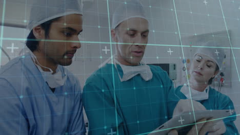 reviewing patient data with digital interface, medical team in scrubs in hospital