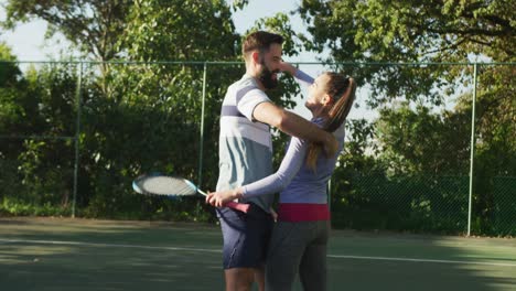 Video-of-happy-caucasian-woman-playing-tennis-on-the-court