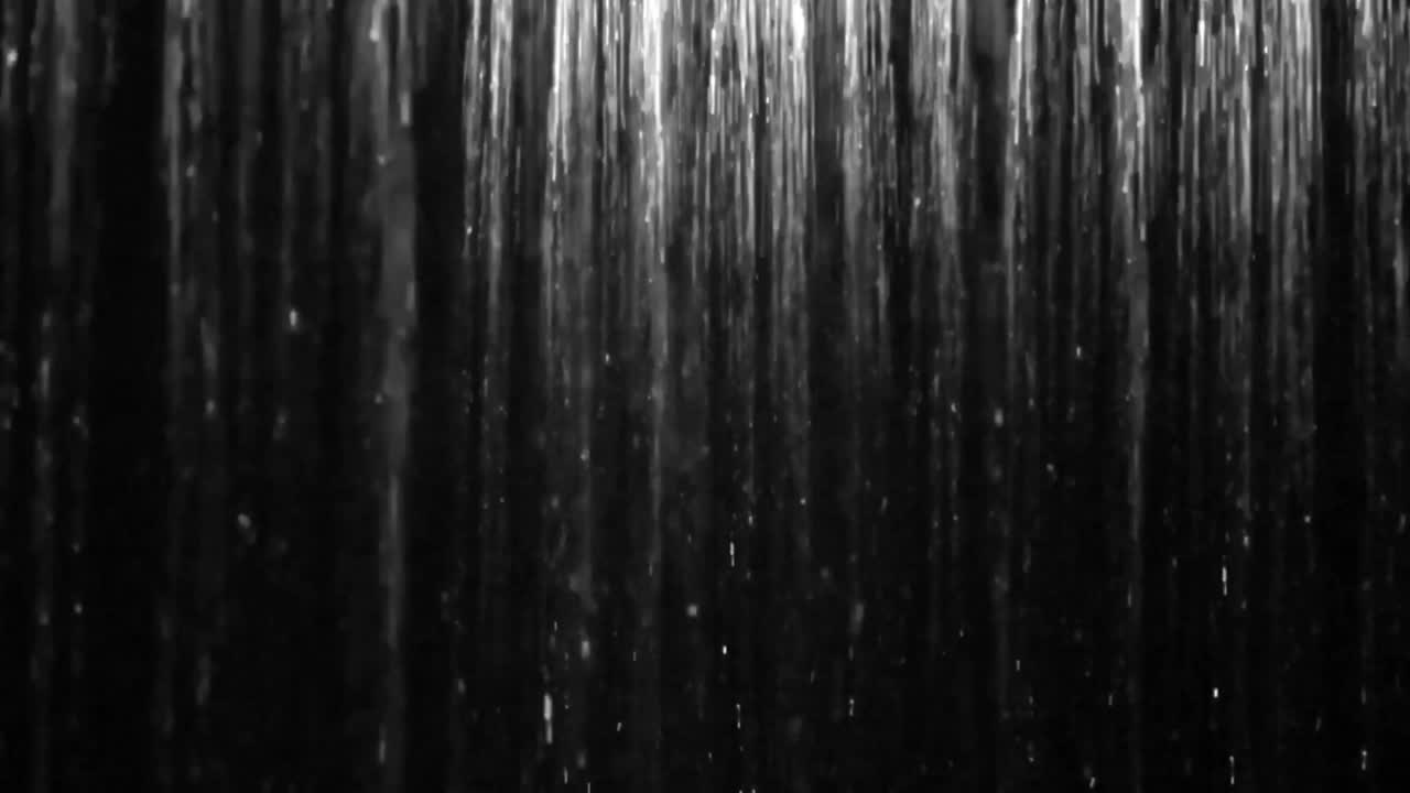 Hot shower with steam on black background