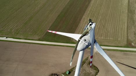 aerial view of wind turbine with broken blade at wind farm