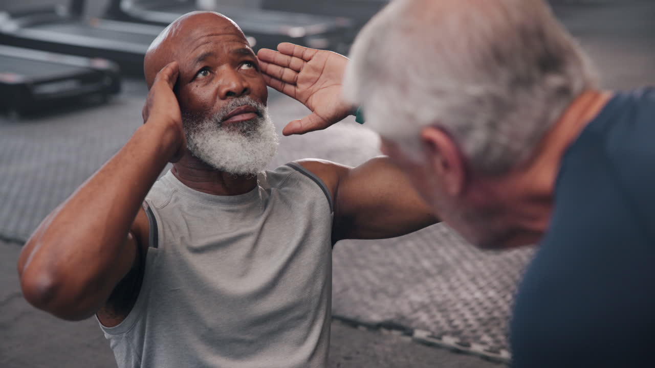 Senior men exercising in the gym