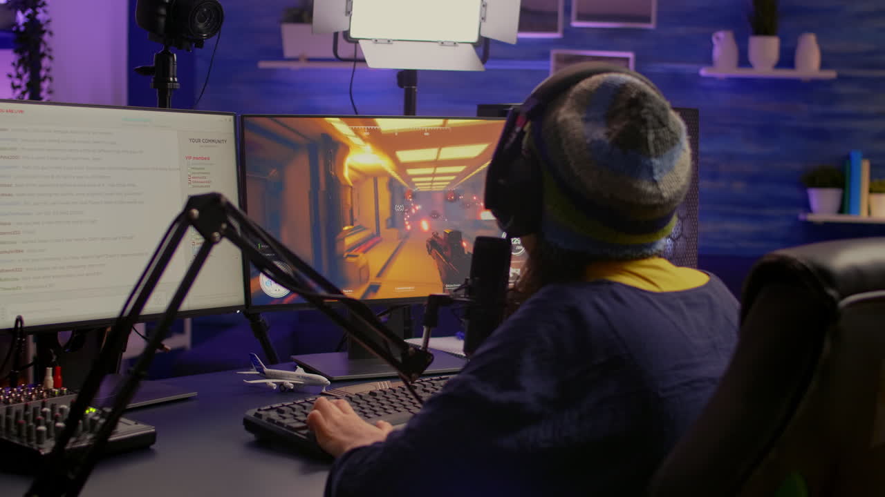 vista de atrás de un streamer profesional jugando a una competencia de juegos