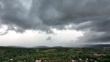 An-aerial-time-lapse-of-a-large-rainstorm-moving-over-the-rural-countryside