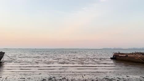 wrecked boat at sunset on pattaya beach