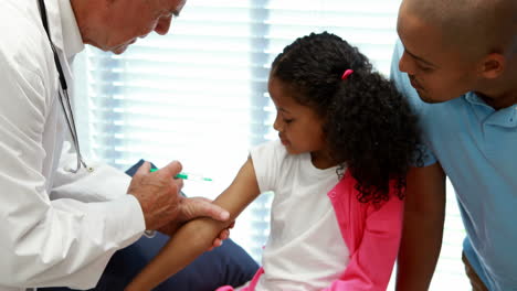 male doctor giving an injection to the patient