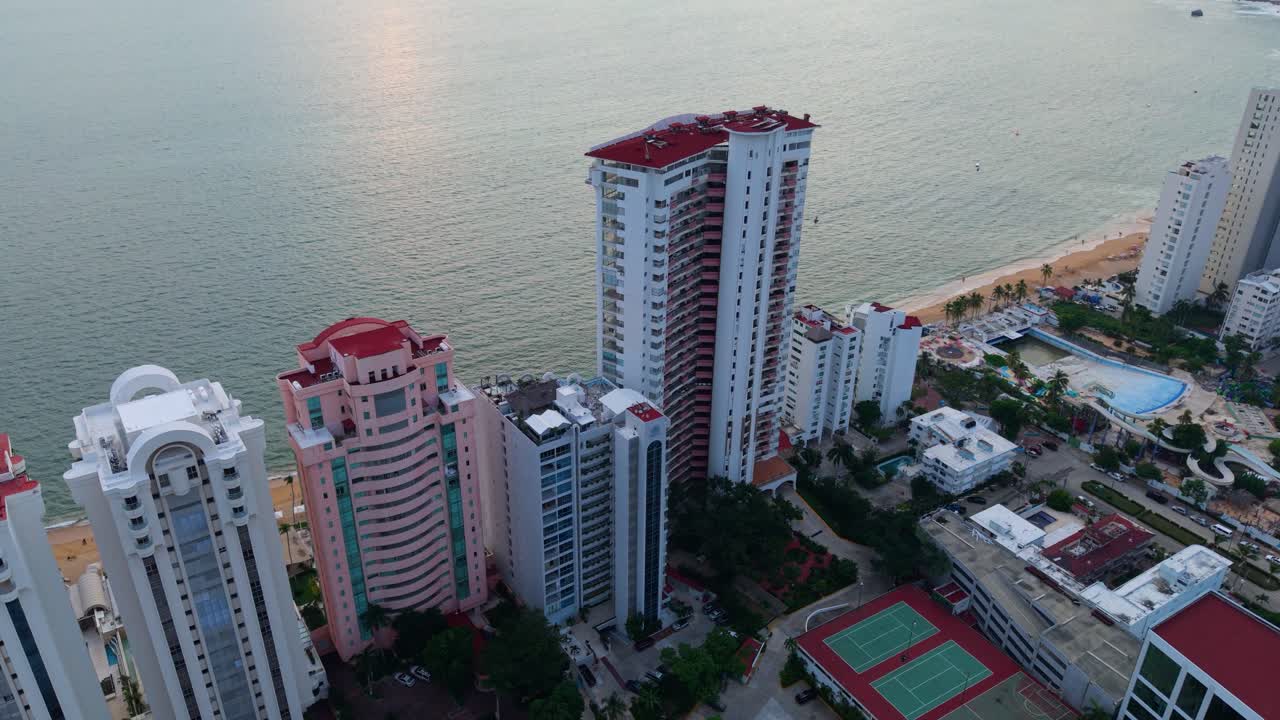 Drone footage showing Acapulco Bay bathed in sunset light