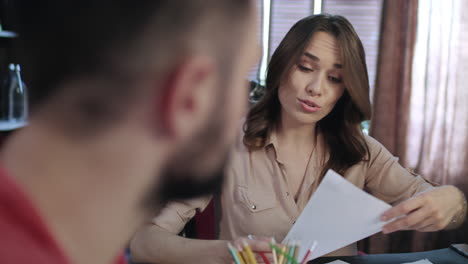 Portrait-of-female-employee-working-in-office.-Smiling-woman-discussing-work