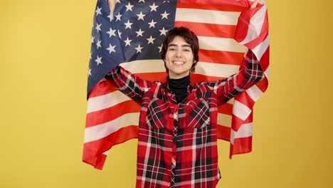 smiling person wrapped in american flag