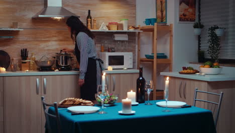 woman preparing romantic dinner