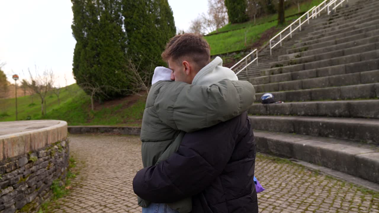 Affectionate LGBTQ Couple Hugging in Park