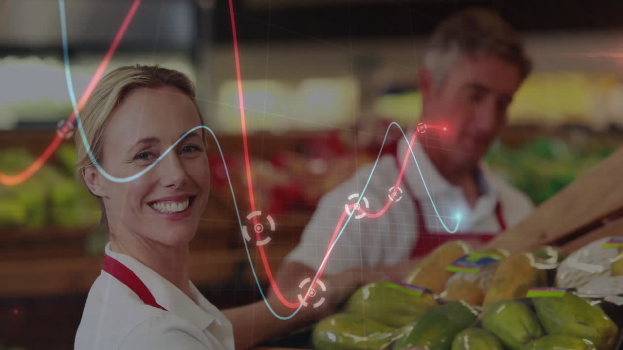 Two grocery employees arranging green peppers in produce section displaying floating inventory data