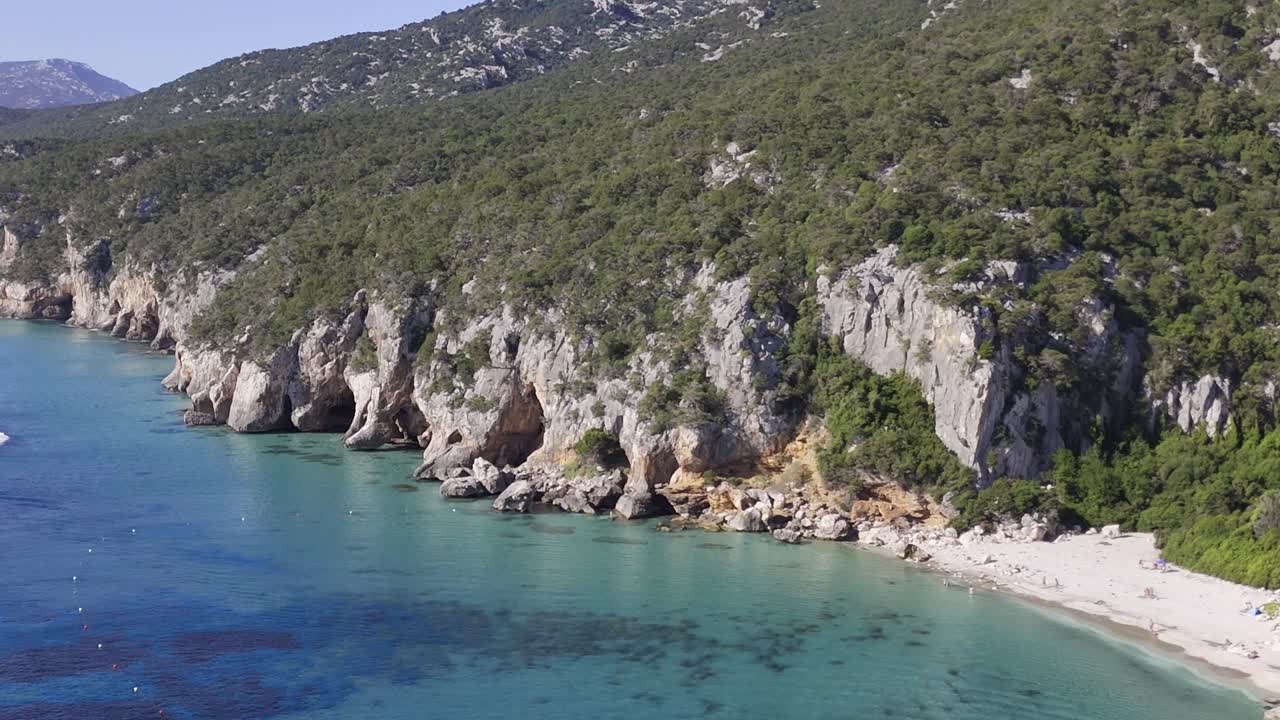 Beautiful Sunny Coastline of Sardinia with Blue Sea and Boats AERIAL