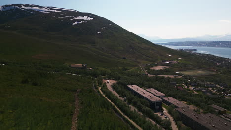 Aerial-view-of-snow-capped-mountainous-terrain-of-Tromso,-Norway