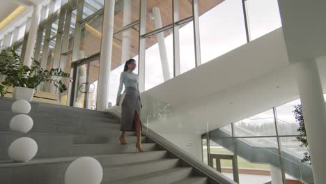 asian business woman going down stairs