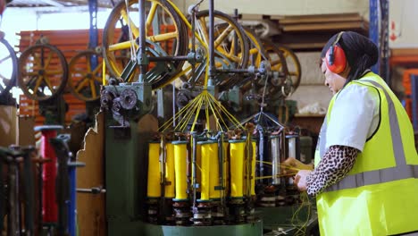 female worker working in rope making industry 4k