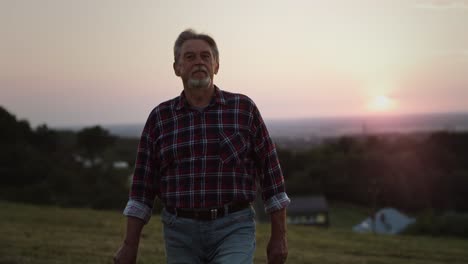 video of proud old man walking on his land