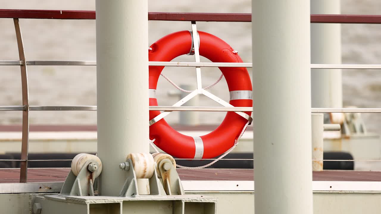 A life buoy on a boat along the Chao Phraya River in Bangkok, Thailand, captured in bright daylight