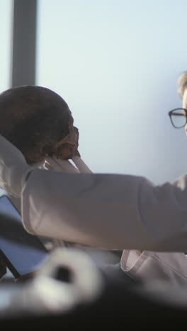 scientists examining a human skull