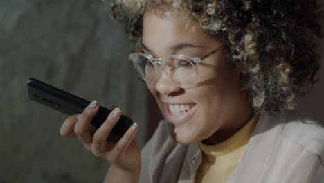woman using smartphone for voice recording