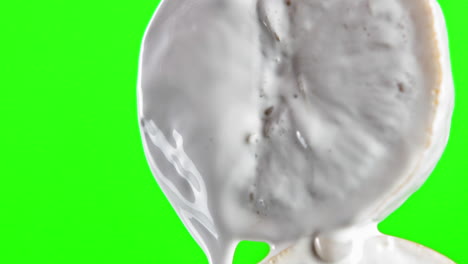 dripping white liquid on food