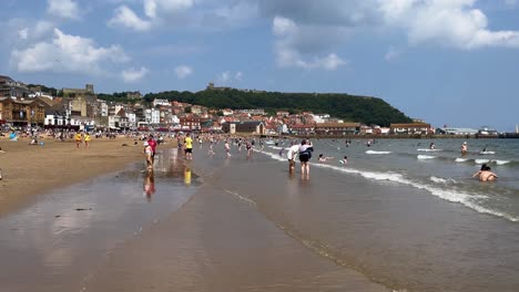 crowded scarborough beach on a sunny summer day