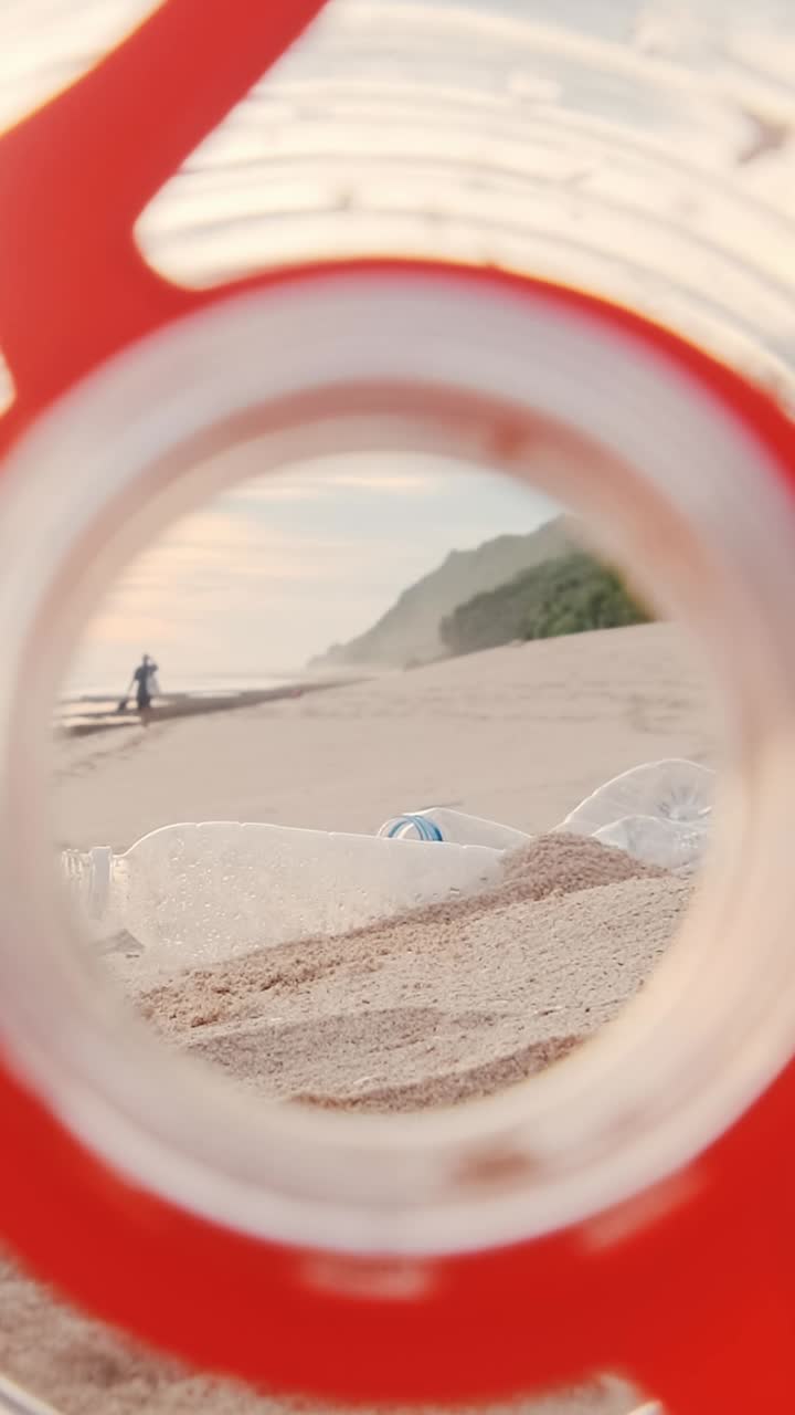 Plastic bottle thrown onto beach litters sea coast and spoils environment