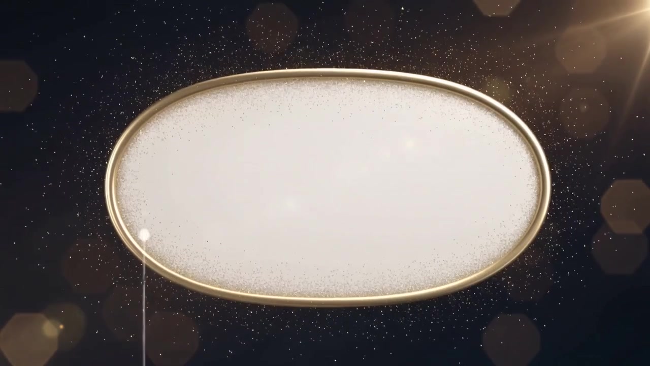 Streaming gold dust from left coating ornate oval plaque gold rim, dark backdrop, lens flare right