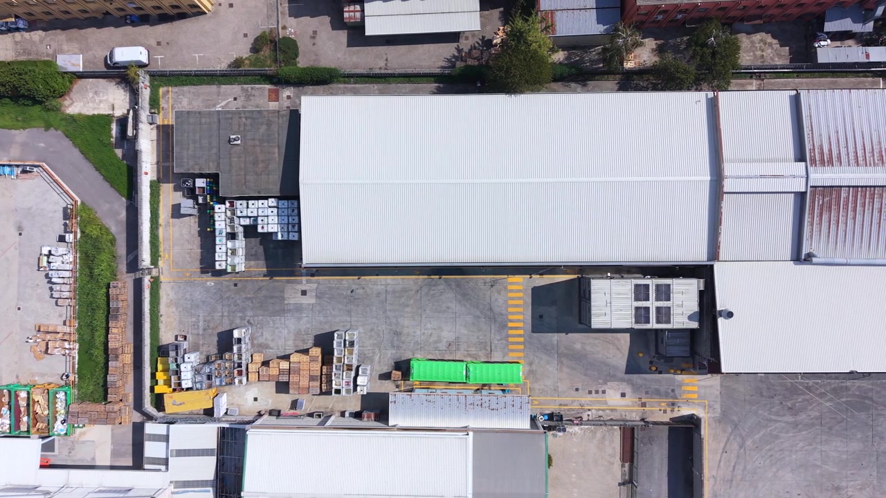 Aerial view of an organized waste management site with storage areas.