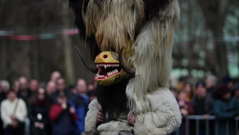 hairy mask with horns and yellow muzzle and big teeths