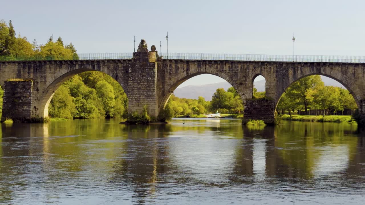 Ponte da Barca and the old Roman bridge over the Lima river in Portugal