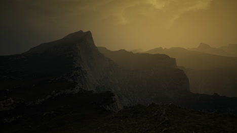 majestic mountain landscape under a golden sky at dusk