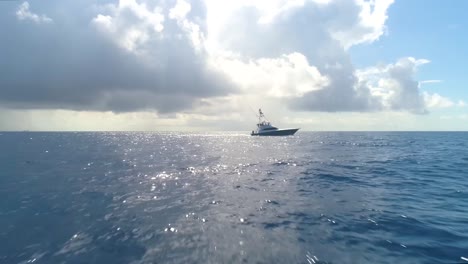 fishing boat pulling away in the ocean