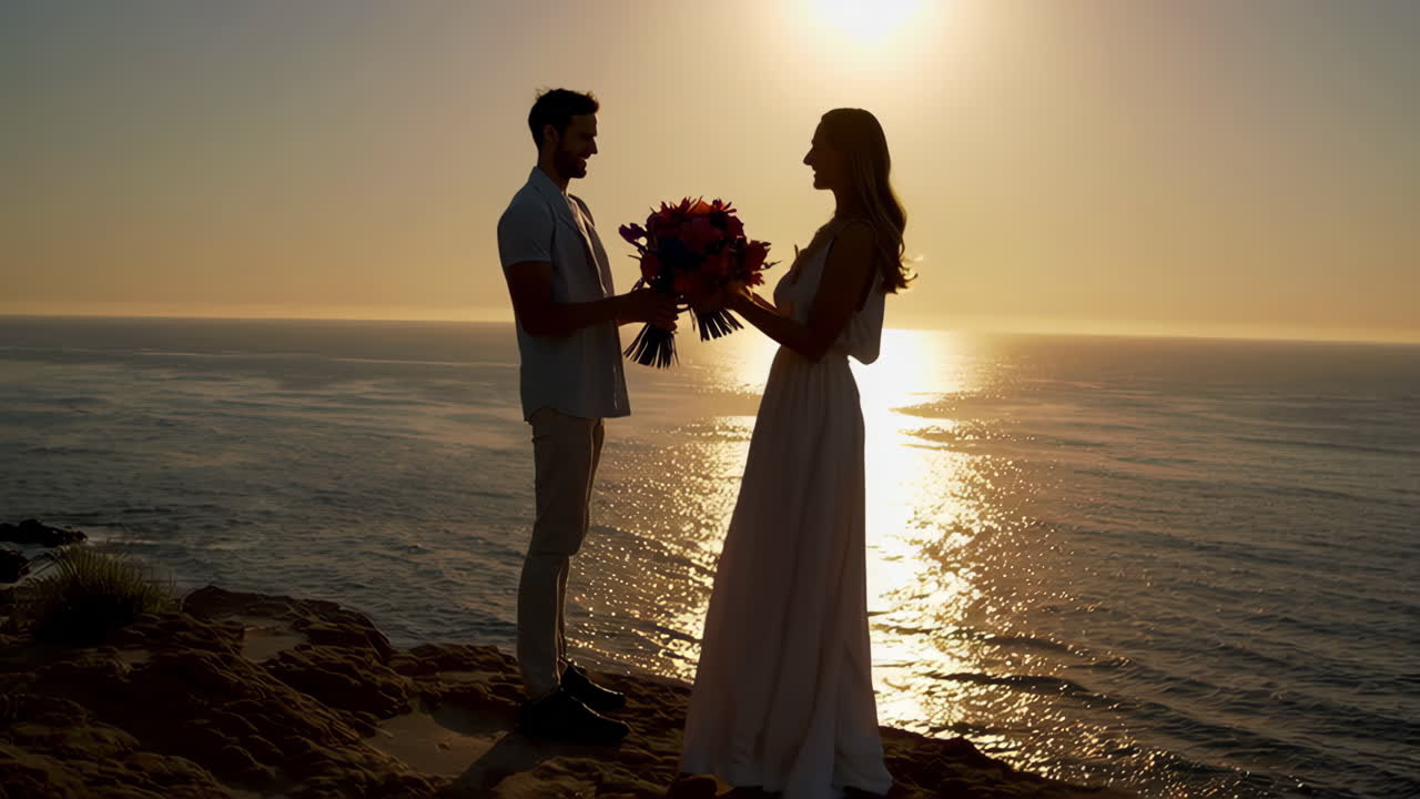 Romantic Sunset Silhouette of a Couple by the Ocean