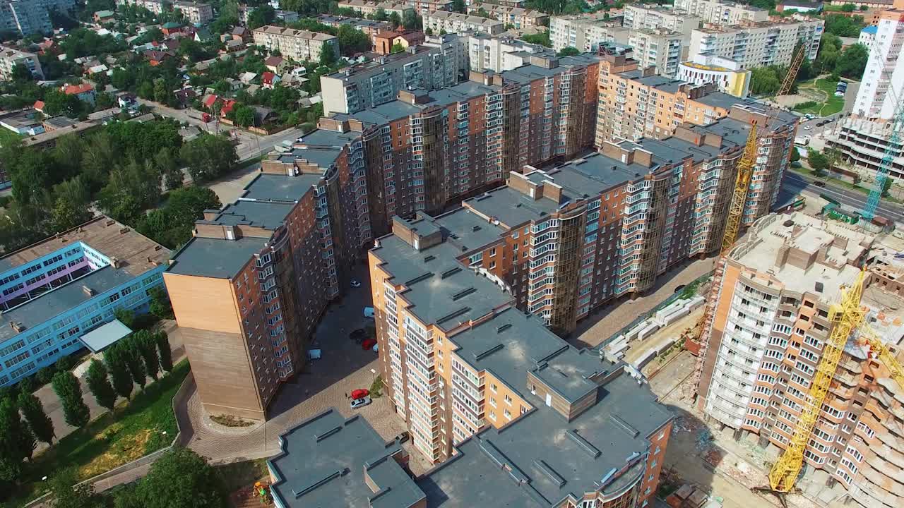Beautiful architecture in the city. Modern district with newly built apartments in the downtown. Urban background from the air. Aerial view.
